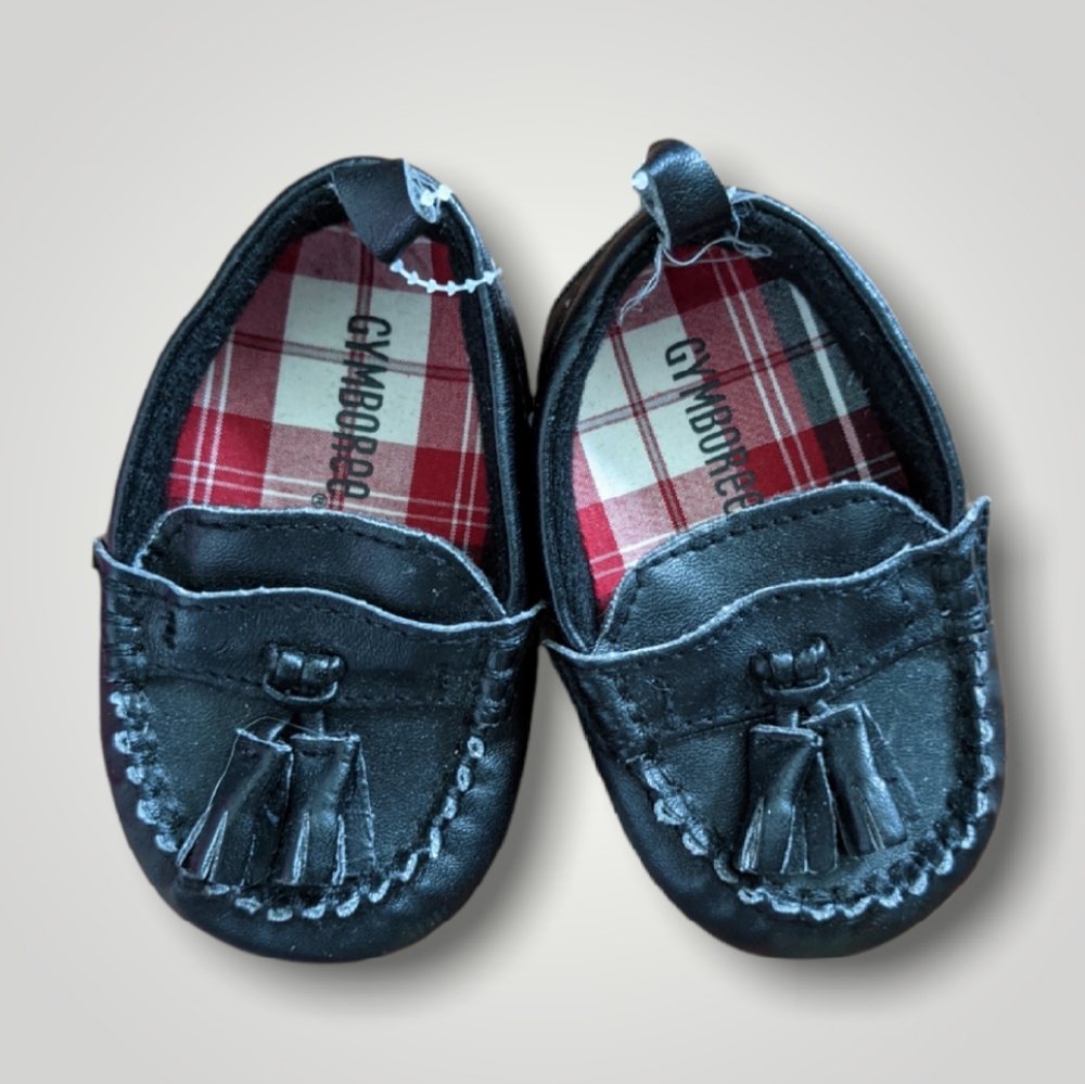 Black moccasin type slip on black shoes